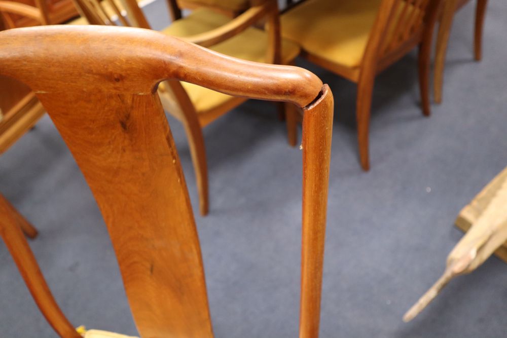A Chinese hardwood dining table, 234cm extended (three spare leaves), width 112cm, height 76cm and eight chairs